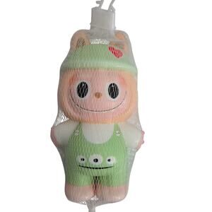 Squishy Monster in Green Three Eyed Overalls and Hat with Love Heart on Hat